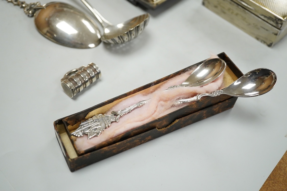 Sundry small silver including a George V mounted photograph frame, James Deakin & Sons, Sheffield, 1918, 14.8cm, a mounted cigarette box, a teaspoon, two vesta cases and thimble, together with assorted plated ware.